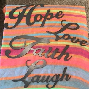 Hanging metal inspirational words for home decor.